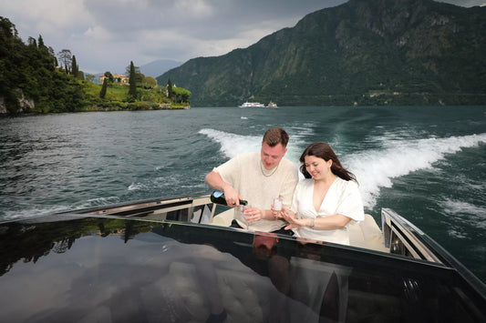 Private boat proposal at golden hour on Lake Como near Bellagio, captured by Nadia Fraqair