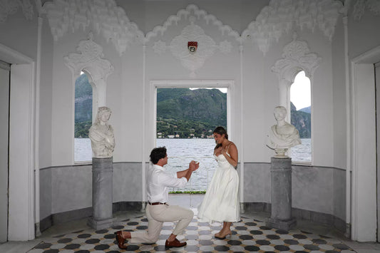 Romantic Lake Como proposal photographed by Nadia Fraqair – styled package with flowers, dress, and golden hour lake views