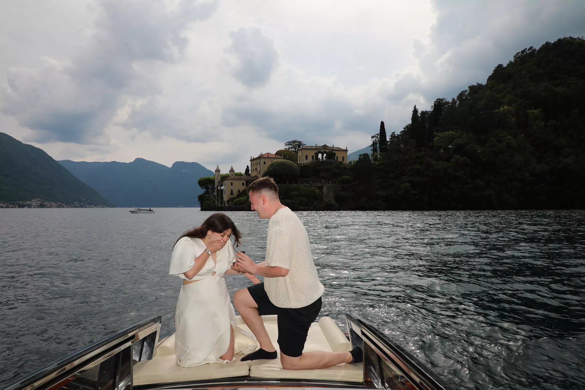 Romantic private boat proposal on Lake Como captured by a luxury proposal photographer