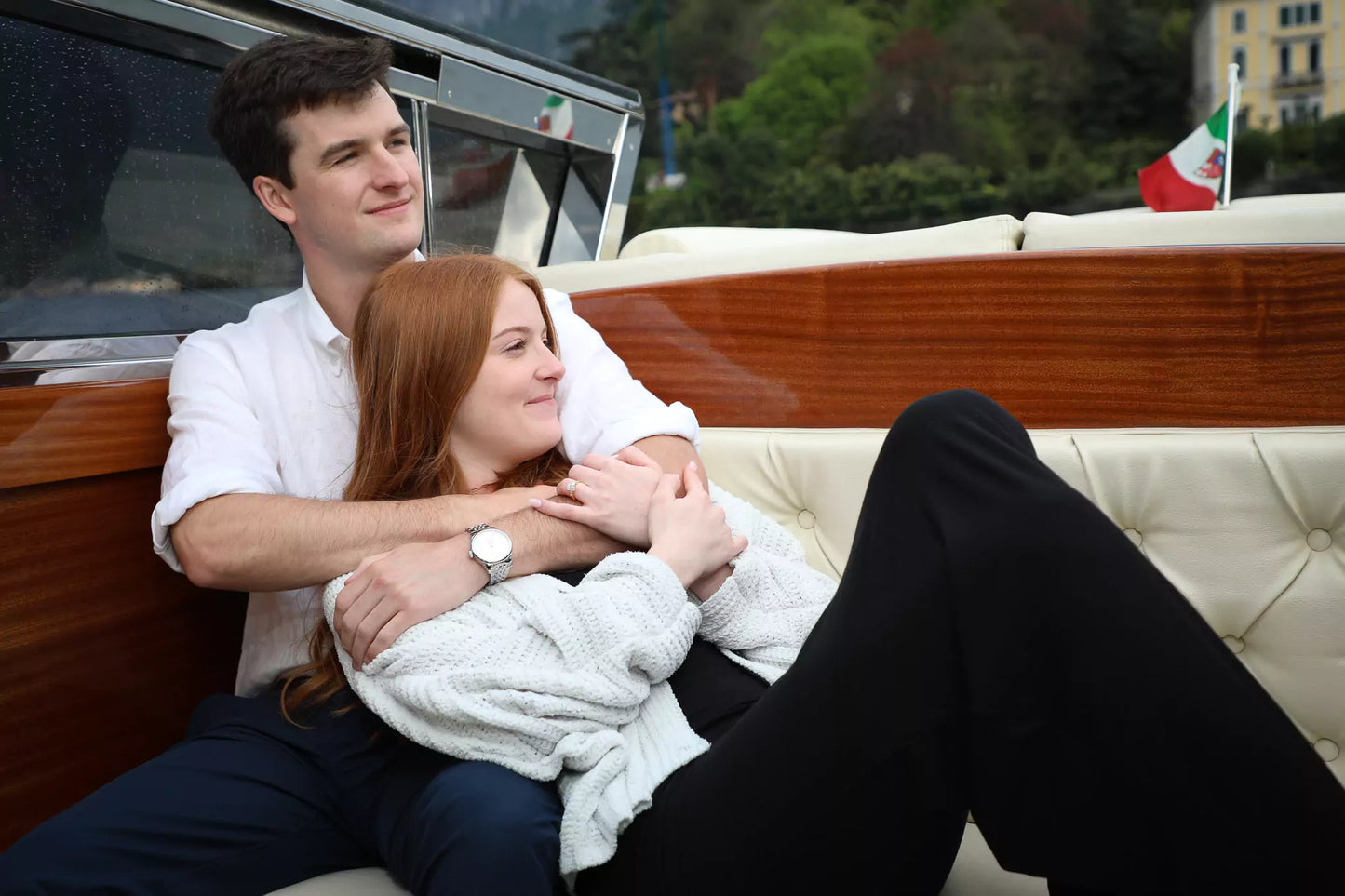 Intimate Lake Como proposal on boat with cover during rainy day