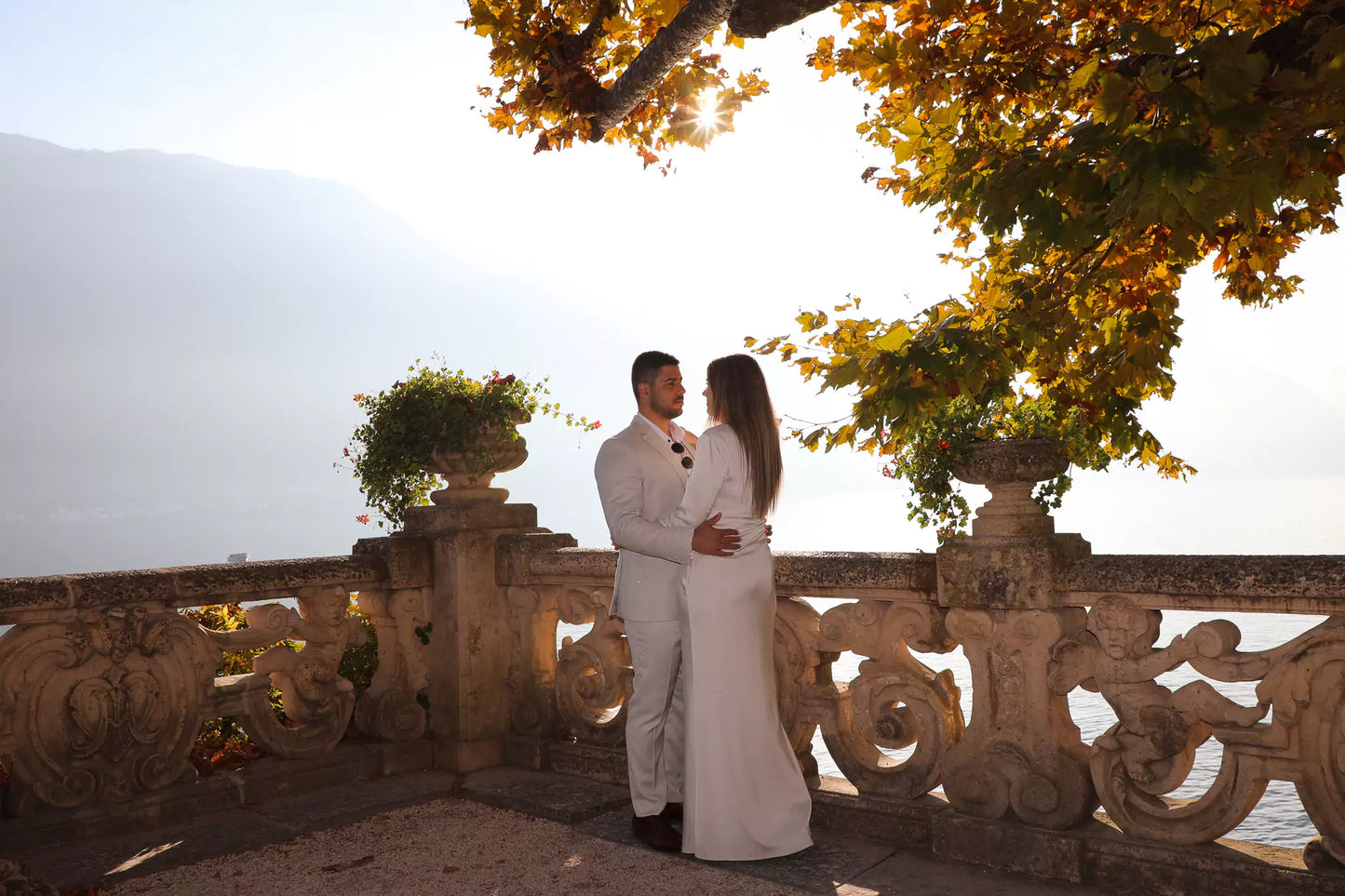 Silhouette of couple during golden hour proposal video in Lake Como