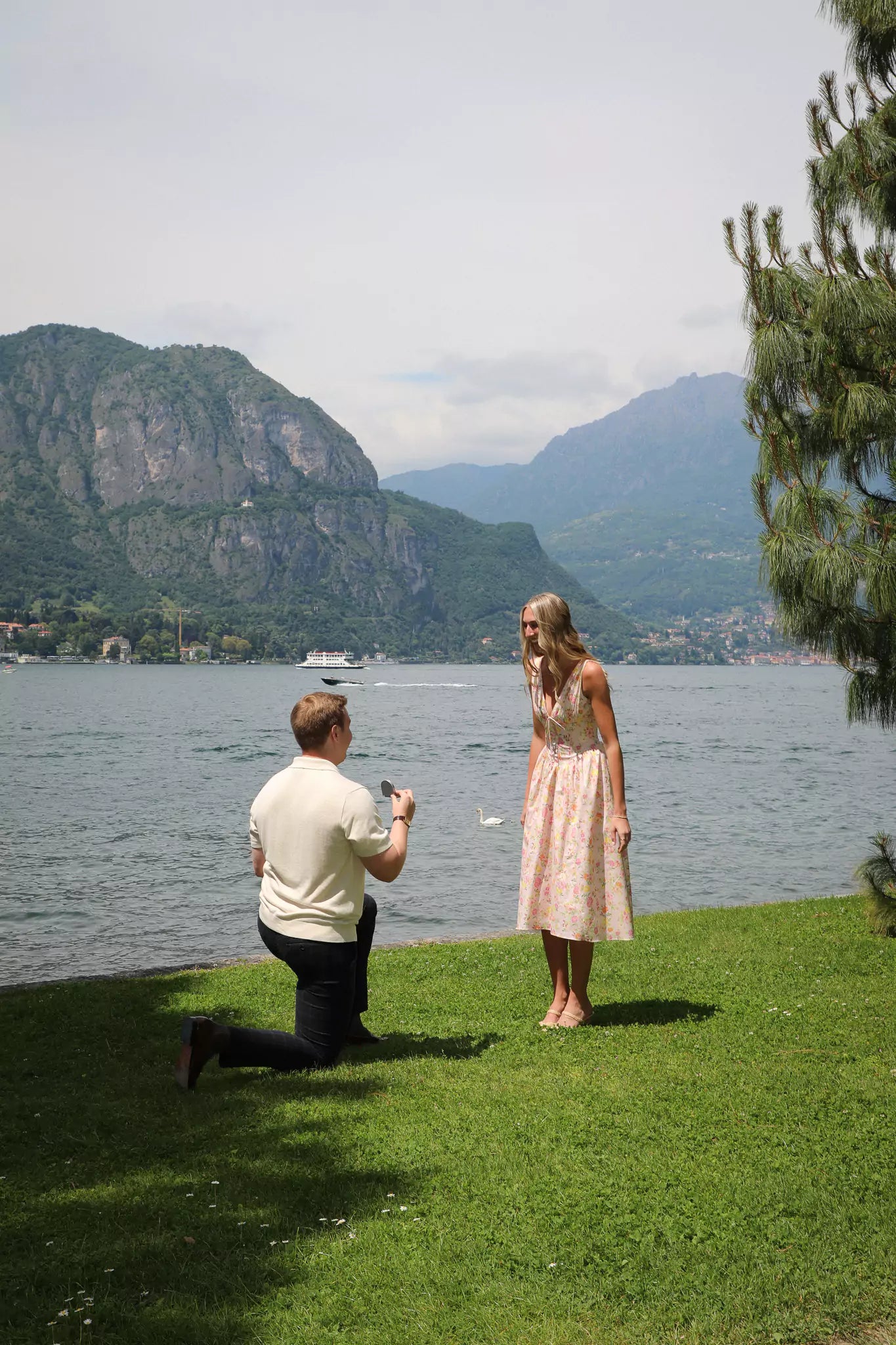 Engaged couple posing for photos at the beautiful Villa Melzi Gardens in Bellagio, Lake Como