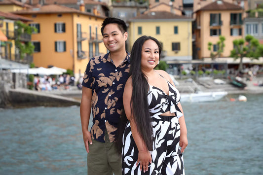 Golden-hour engagement photo on Varenna waterfront with pastel houses and Lake Como views — by Nadia Fraqair