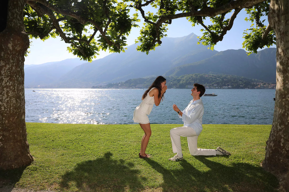 Surprise proposal by Lake Como captured by photographer Nadia Fraqair — romantic lakeside moment with emotional reaction and cinematic light