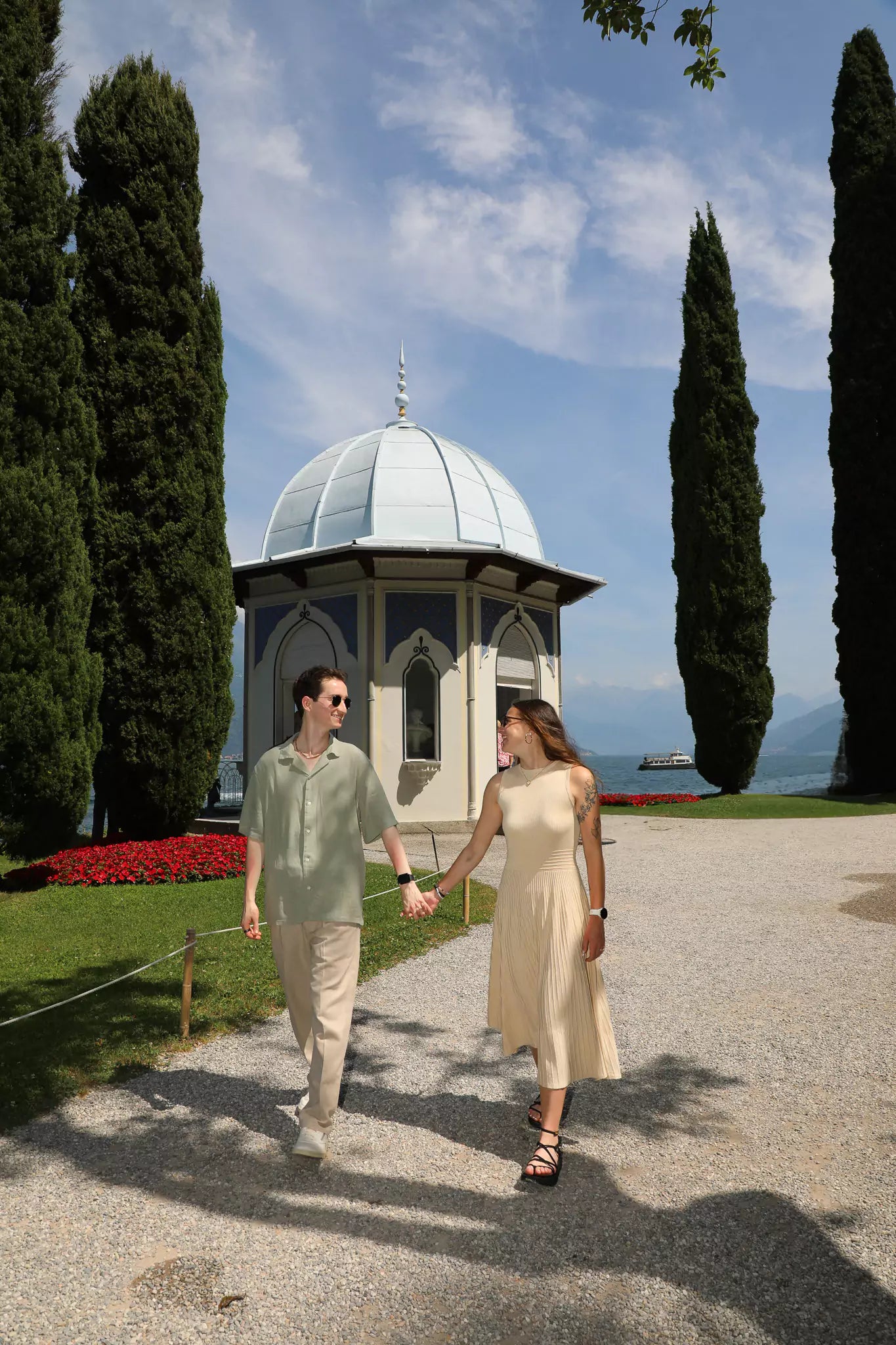 Couple walking through lakeside gardens in Bellagio
