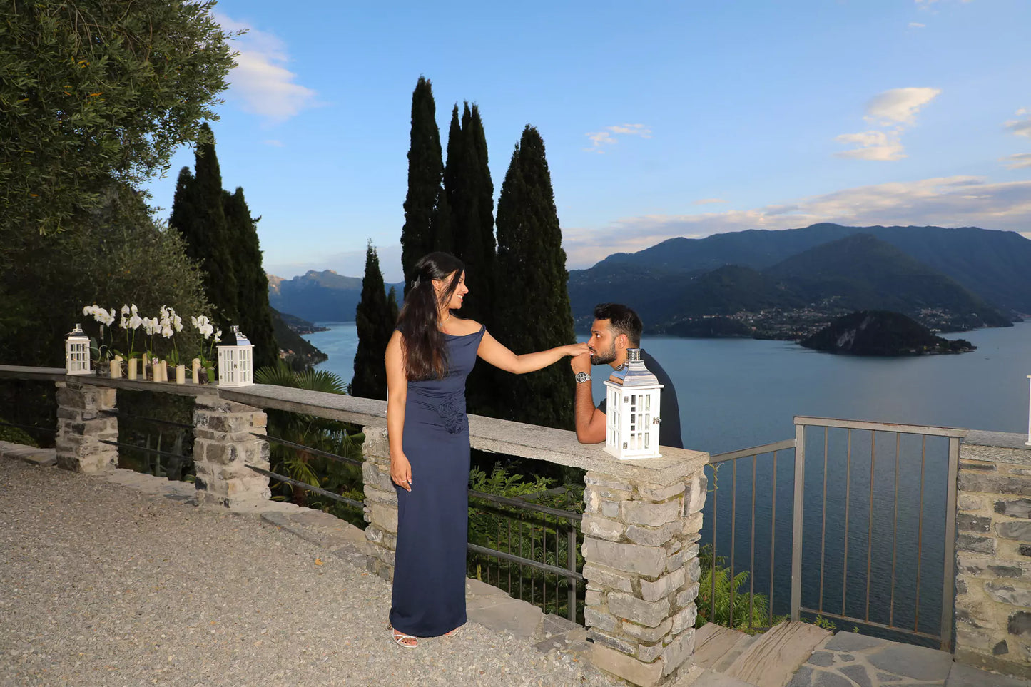 Aerial drone shot of couple at Castello di Vezio overlooking Lake Como