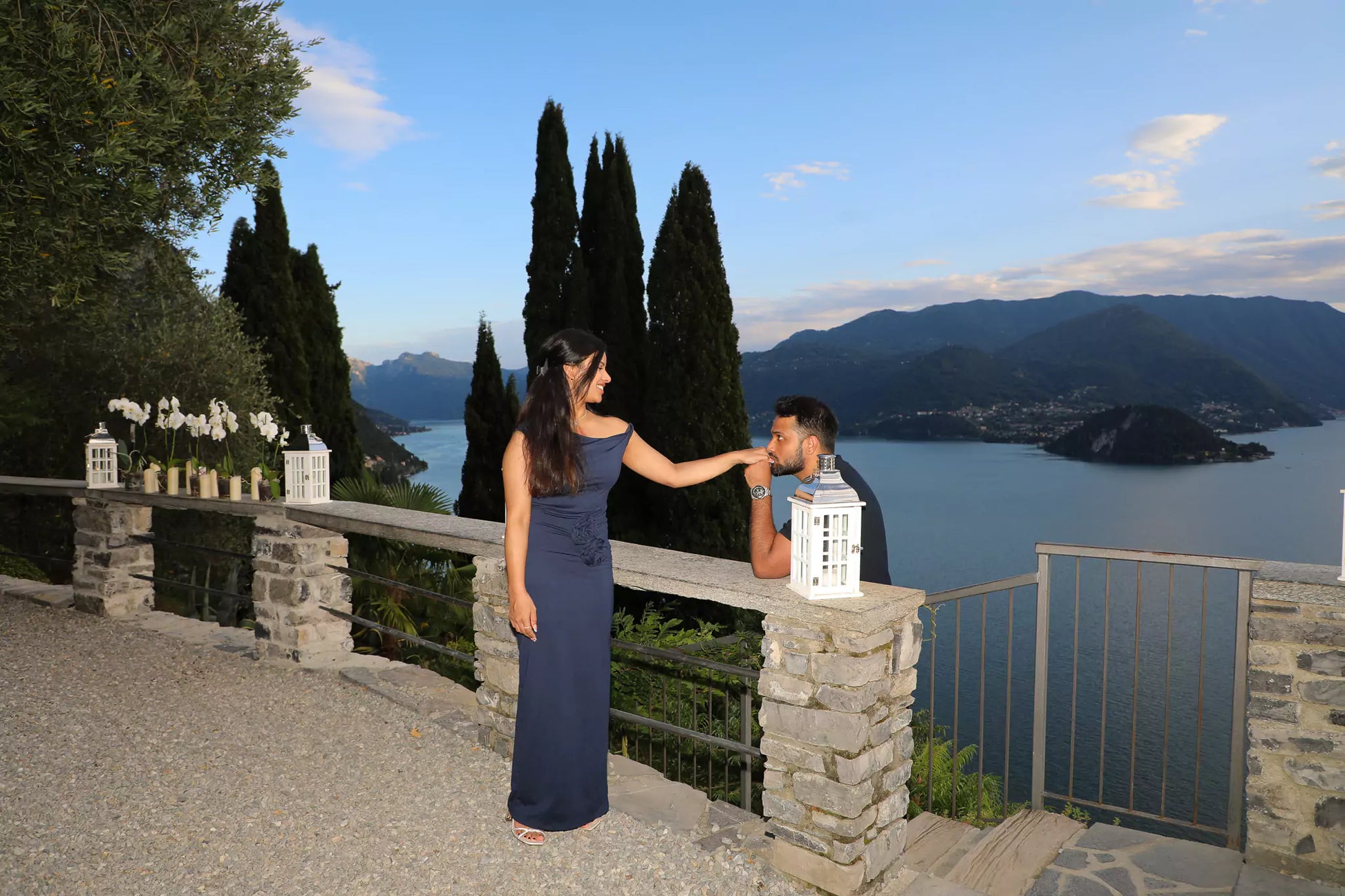 Aerial drone shot of couple at Castello di Vezio overlooking Lake Como
