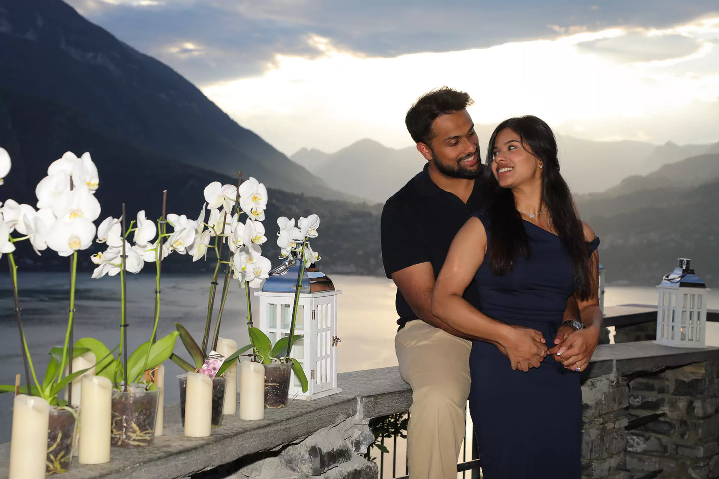 Couple silhouetted during sunset proposal at Castello di Vezio