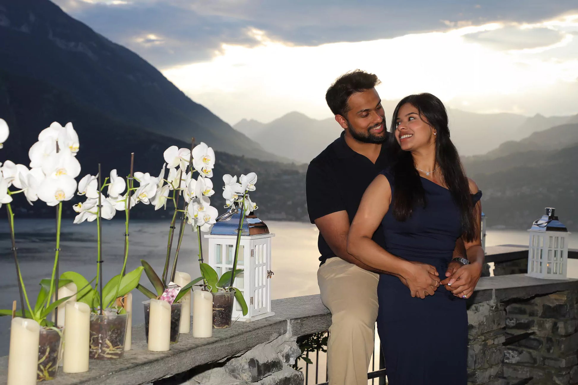 Couple silhouetted during sunset proposal at Castello di Vezio