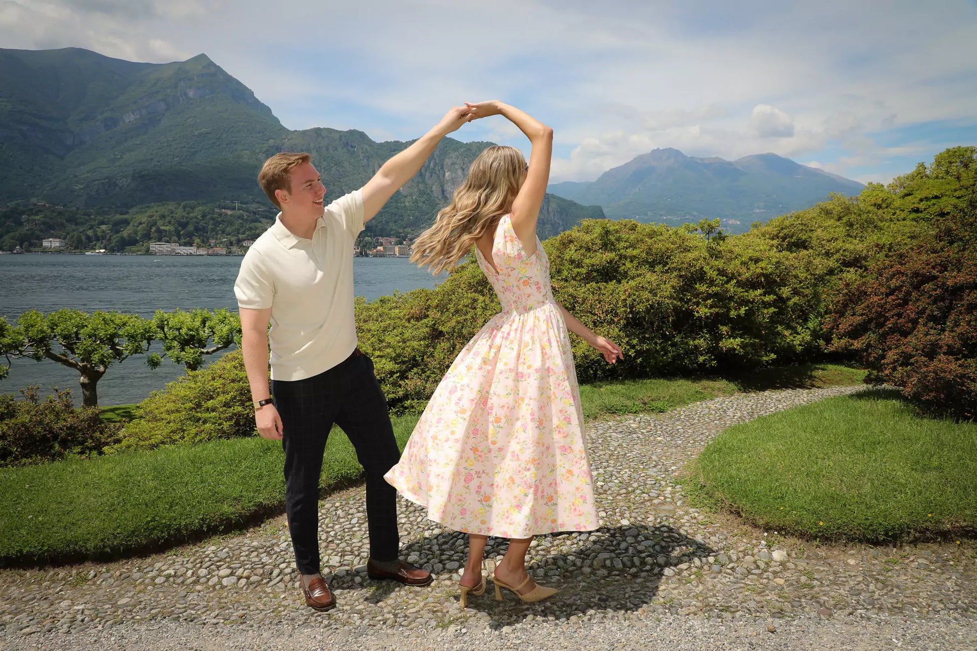 Just engaged couple celebrating at Villa Melzi Gardens with Lake Como scenery
