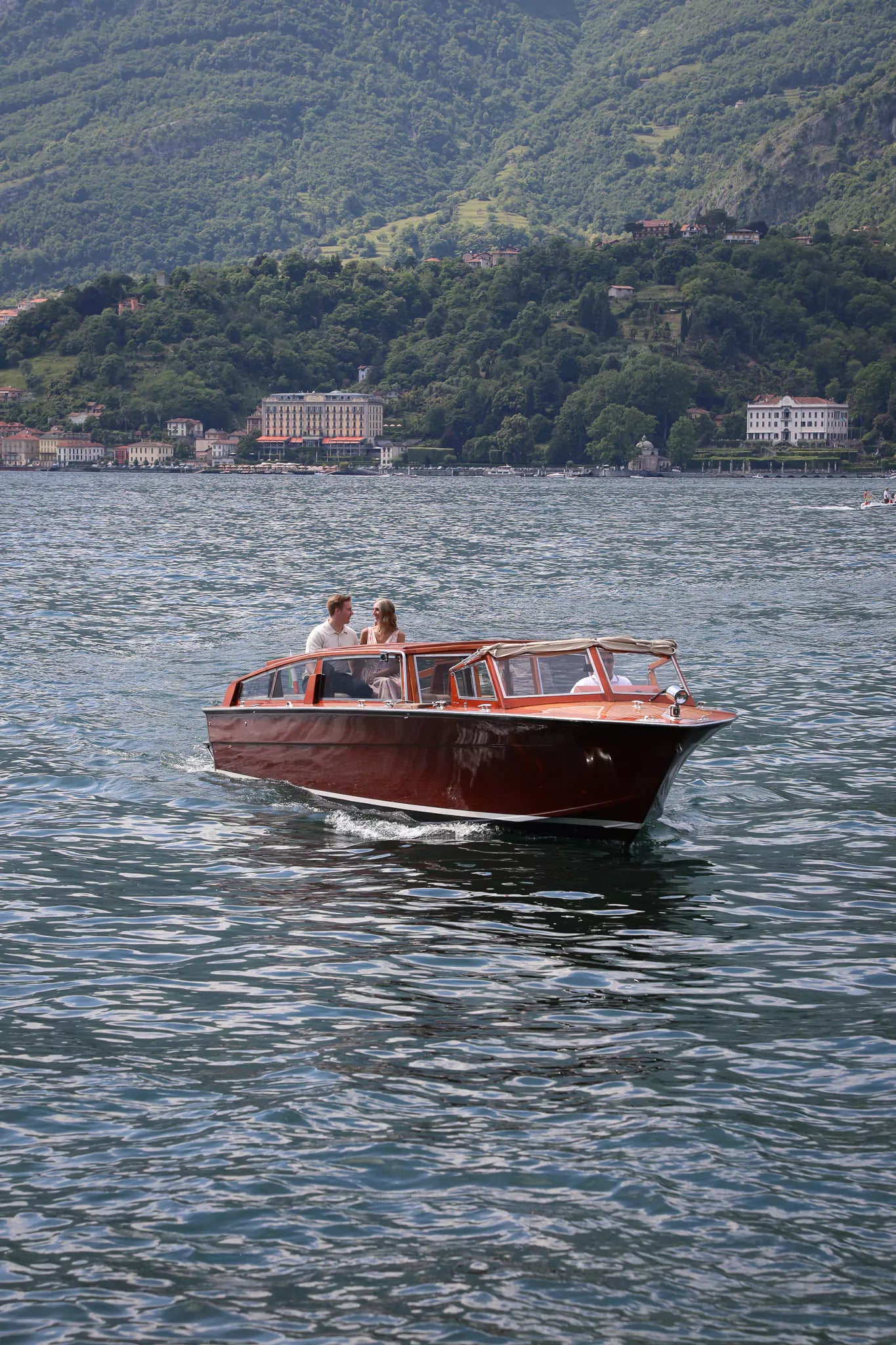 Elegant private boat waiting at Villa Melzi Gardens as part of a luxury Lake Como proposal upgrade