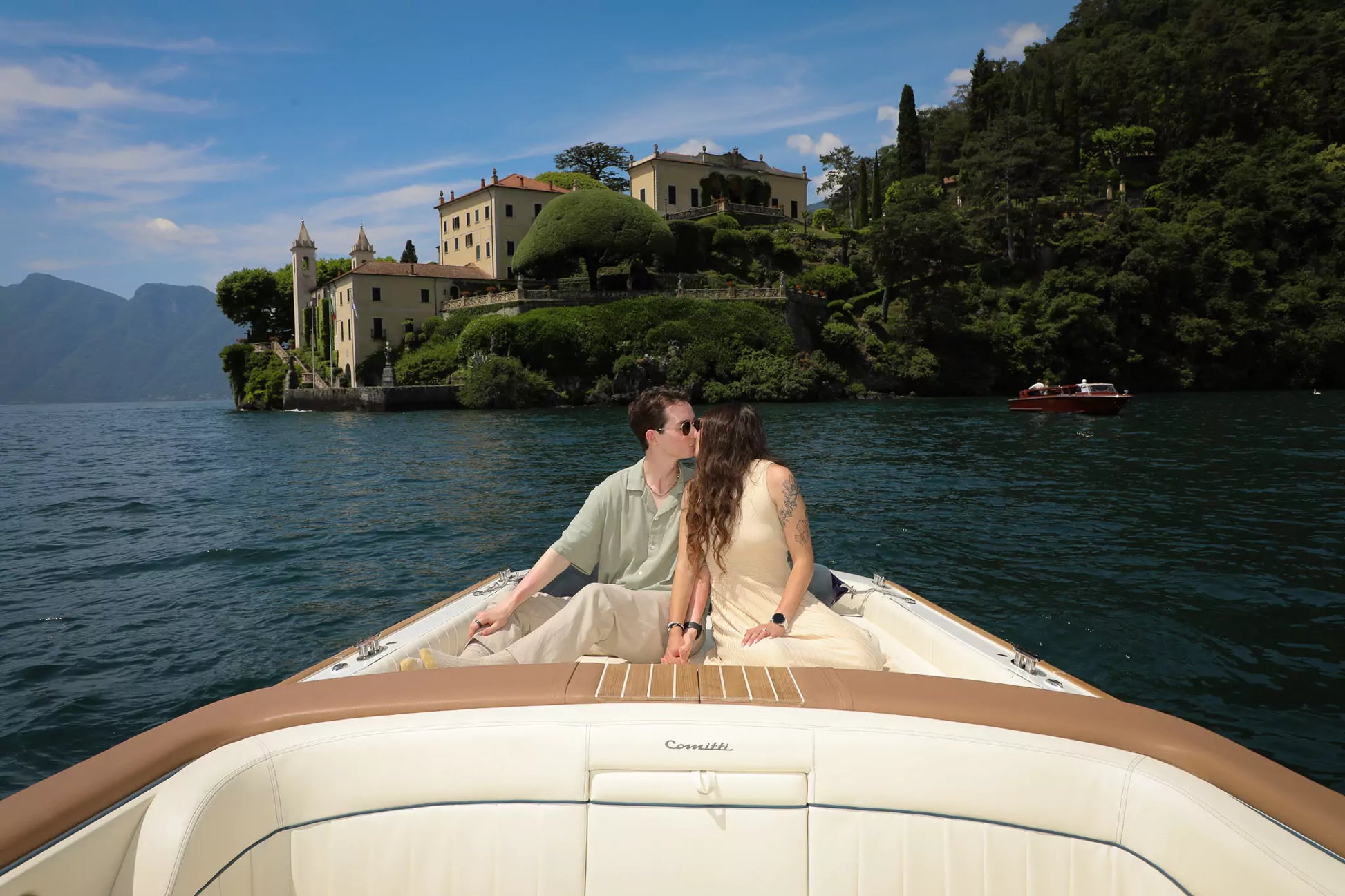 Romantic Lake Como engagement photo session on a classic Riva boat