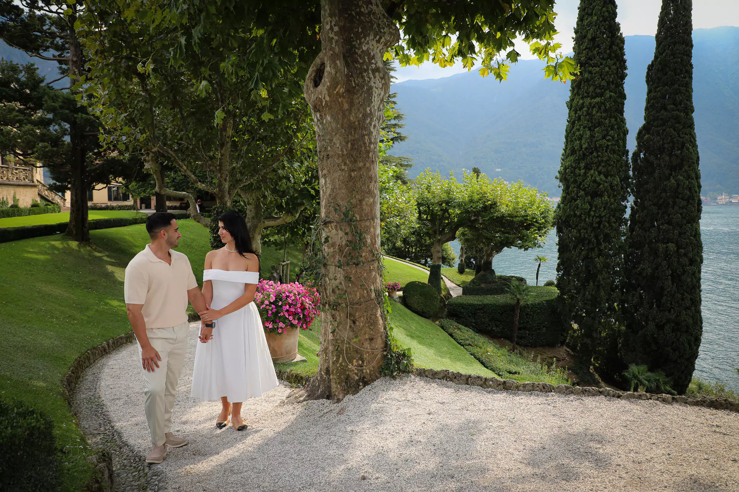 Couple walking hand in hand during styled Lake Como proposal photo shoot