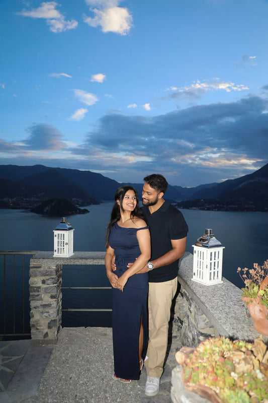 Couple embracing after proposal at Castello di Vezio, captured by Nadia Fraqair