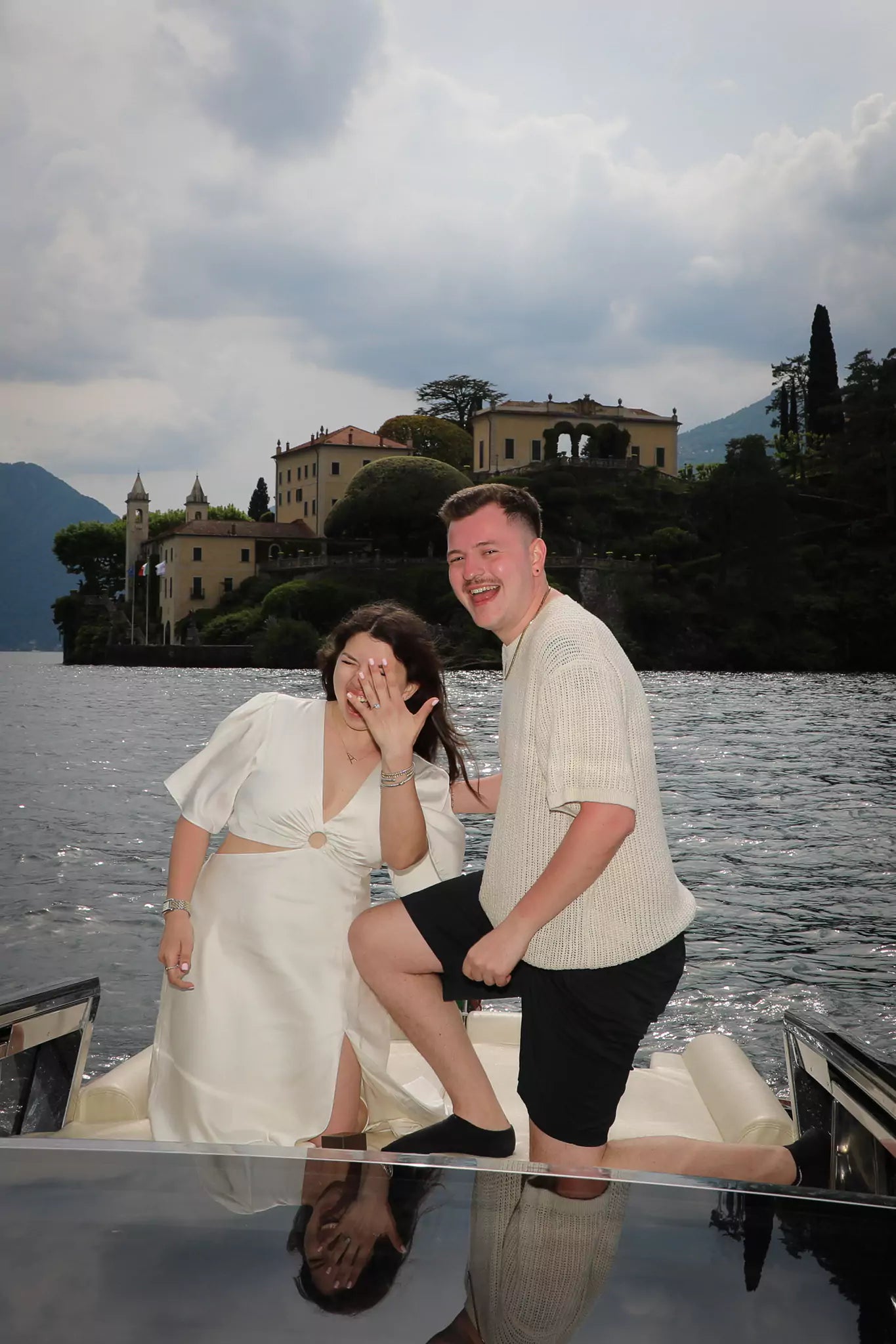 Engagement photo shoot on classic Riva boat during Lake Como proposal