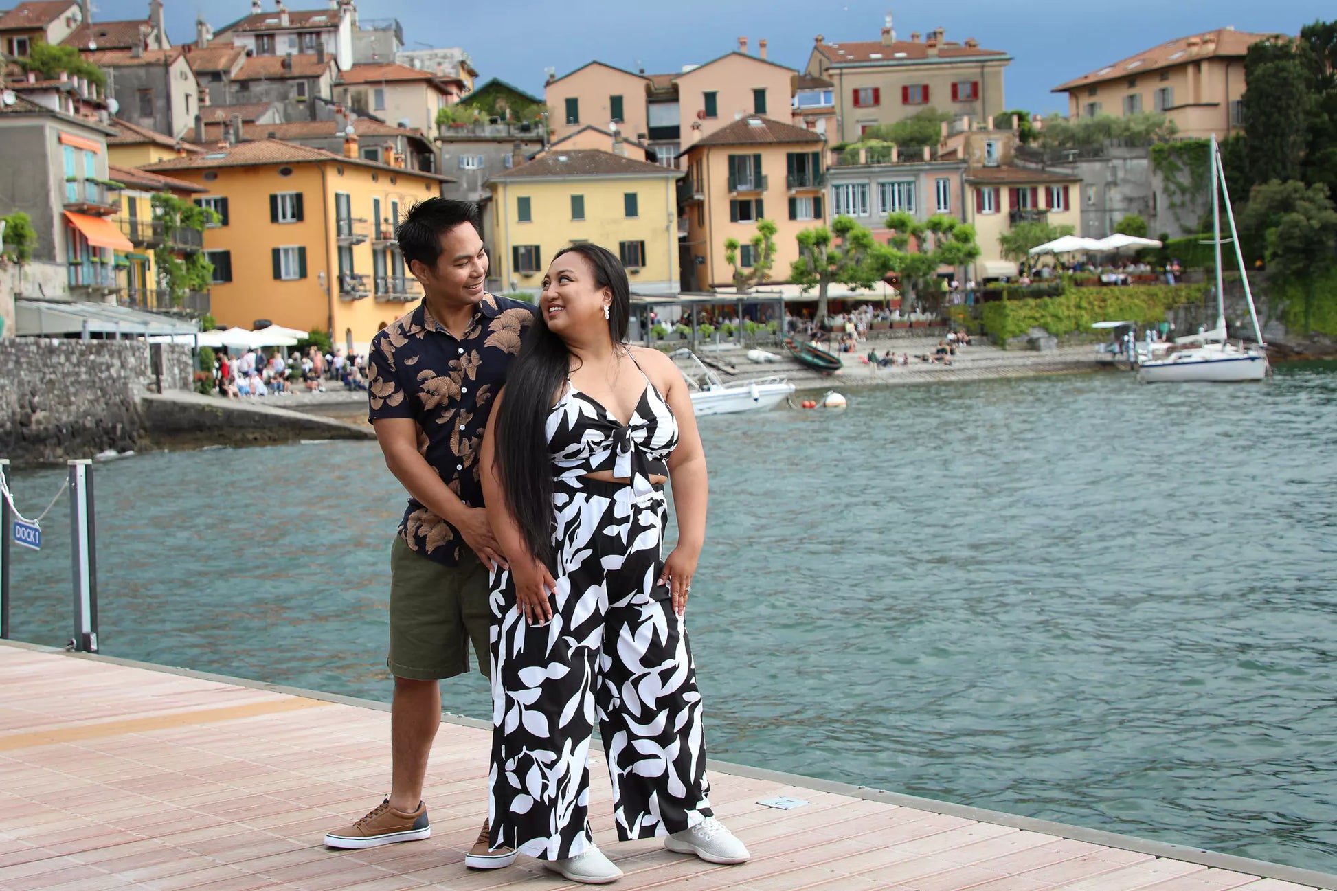 Couple walking on the lakeside walkway in Varenna