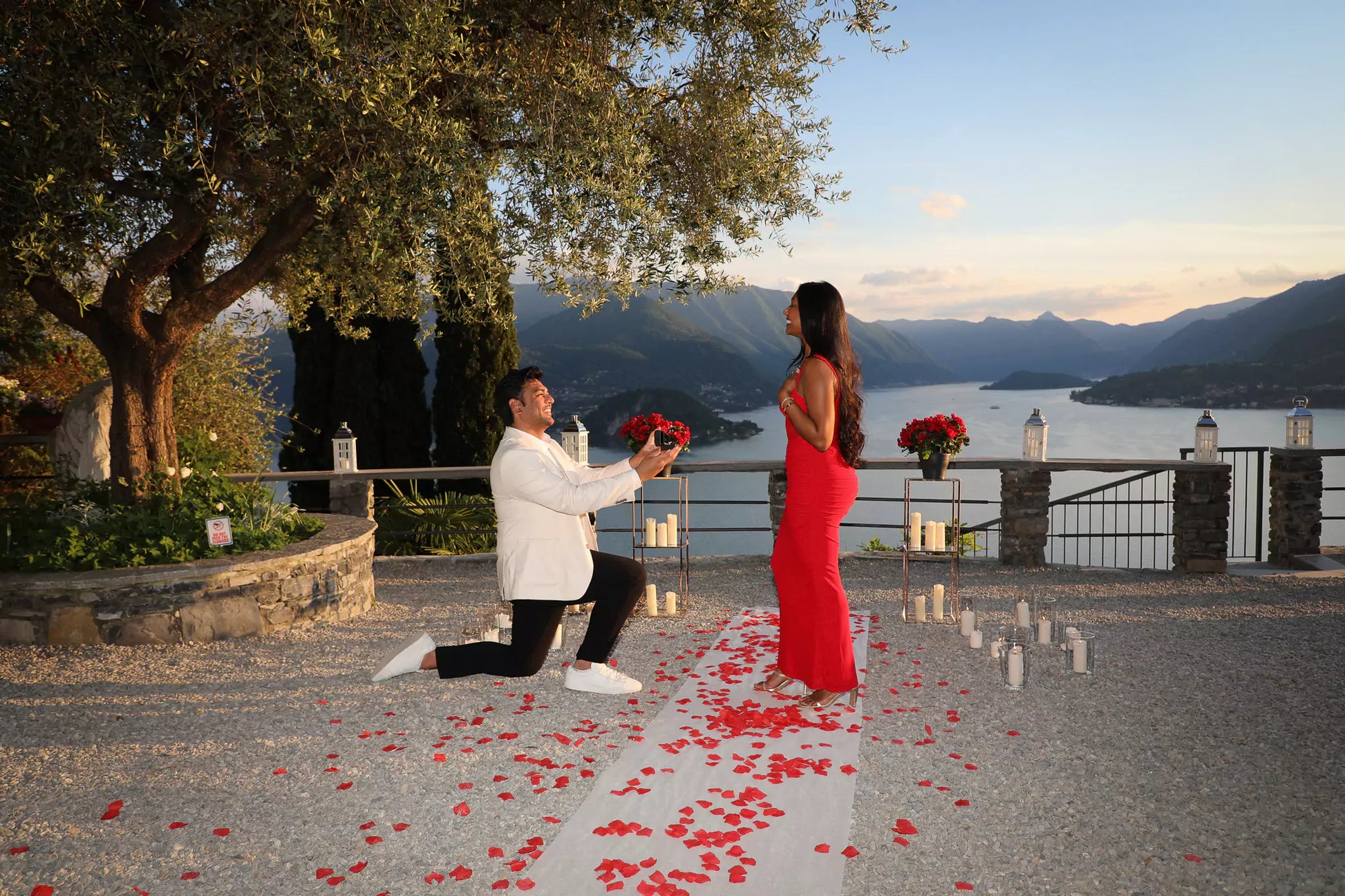 Engaged couple overlooking Lake Como from Vezio Castle during their photo session