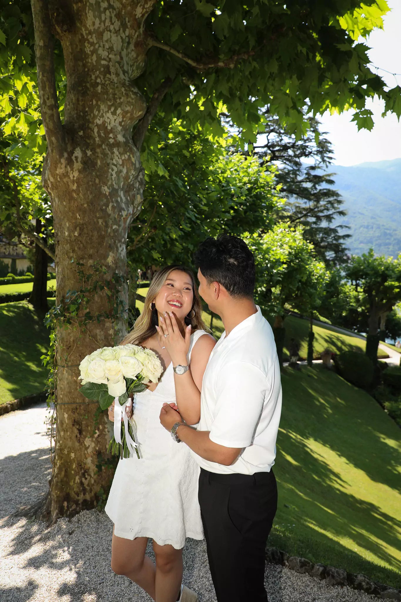 Champagne toast celebrating a successful proposal at Villa del Balbianello