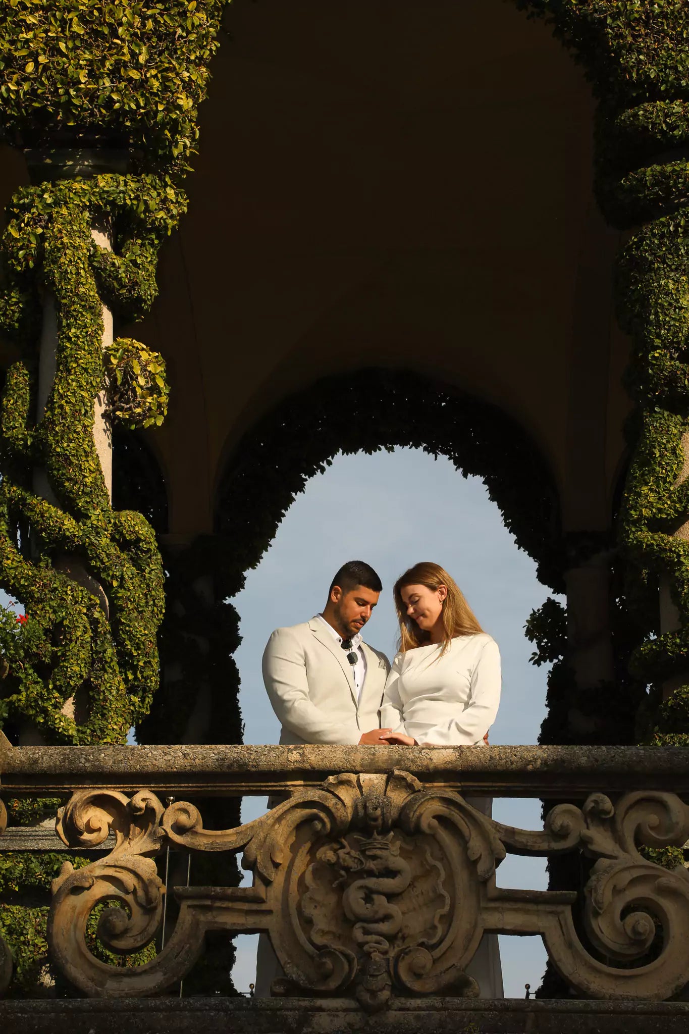 Couple watching their Lake Como engagement proposal video on phone